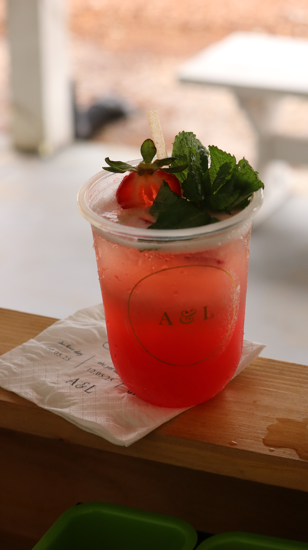 Strawberry mint signature cocktail with custom A&L wedding branding